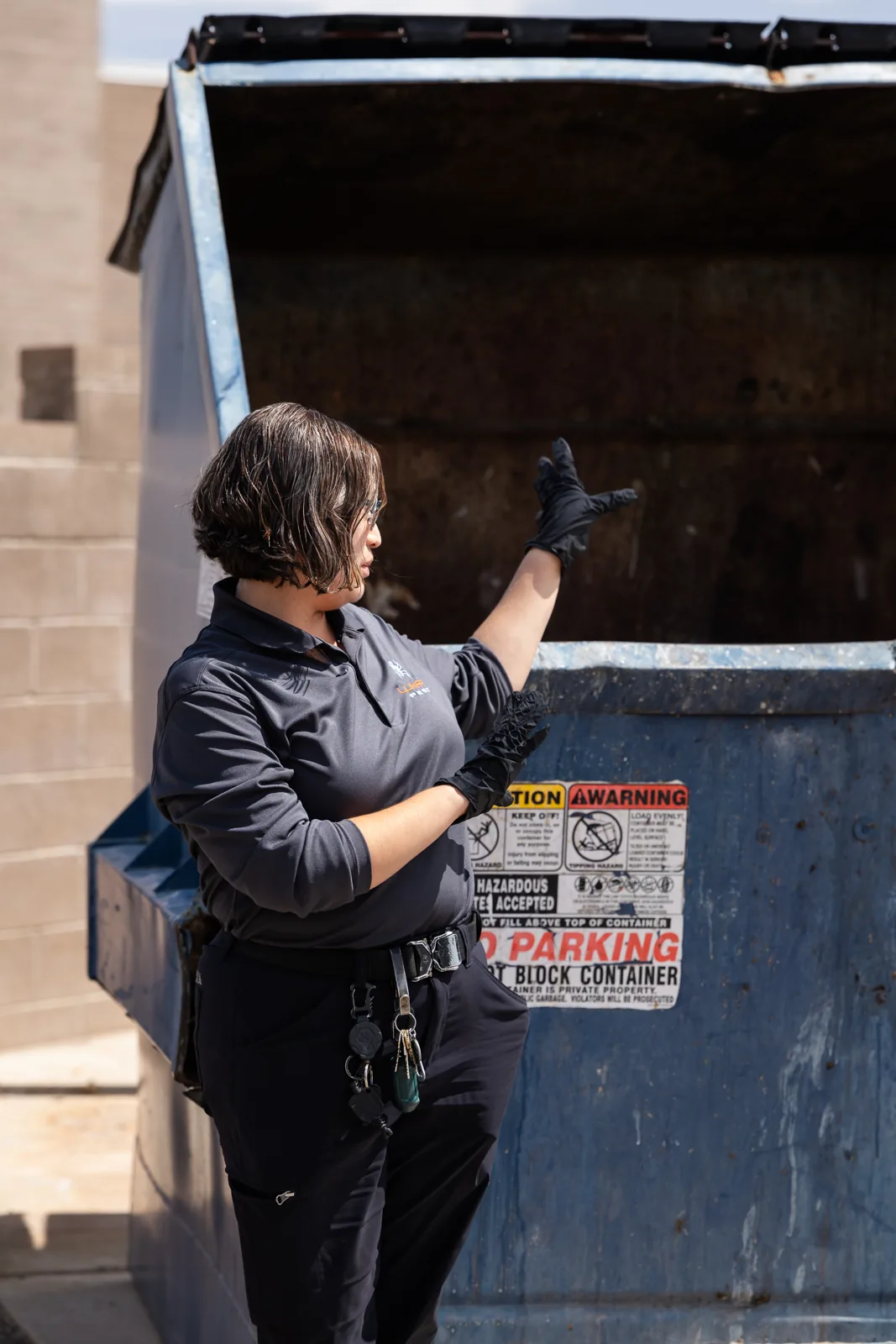 Lunar Pest technician inspecting the trash enclosure at an assisted living facility
