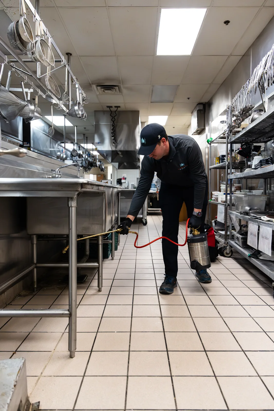 Lunar Pest technician treating the commercial kitchen at an Arizona senior and assisted living facility